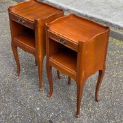 2 Louis XV bedside tables made of curved solid wood with drawers.