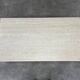 Rectangular travertine coffee table with central leg