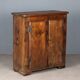 Antique pine wardrobe painted in walnut stain, restorations, Italy, 17th century.