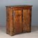 Antique pine wardrobe painted in walnut stain, restorations, Italy, 17th century.