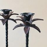 Pair of patinated metal candlesticks