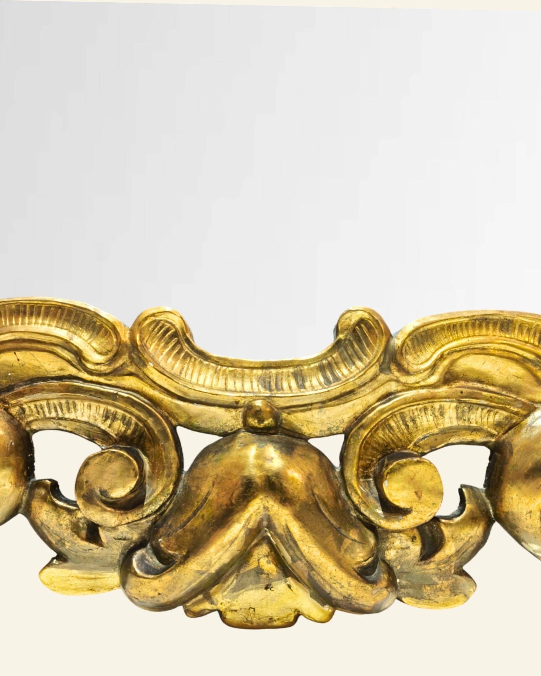 Antique wall mirror in carved and gilded wood, baroque style, 140 × 115 cm