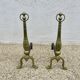 Pair of Neo-classical andirons, in solid bronze, 1920s-1930s.