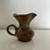 Patinated stoneware jug