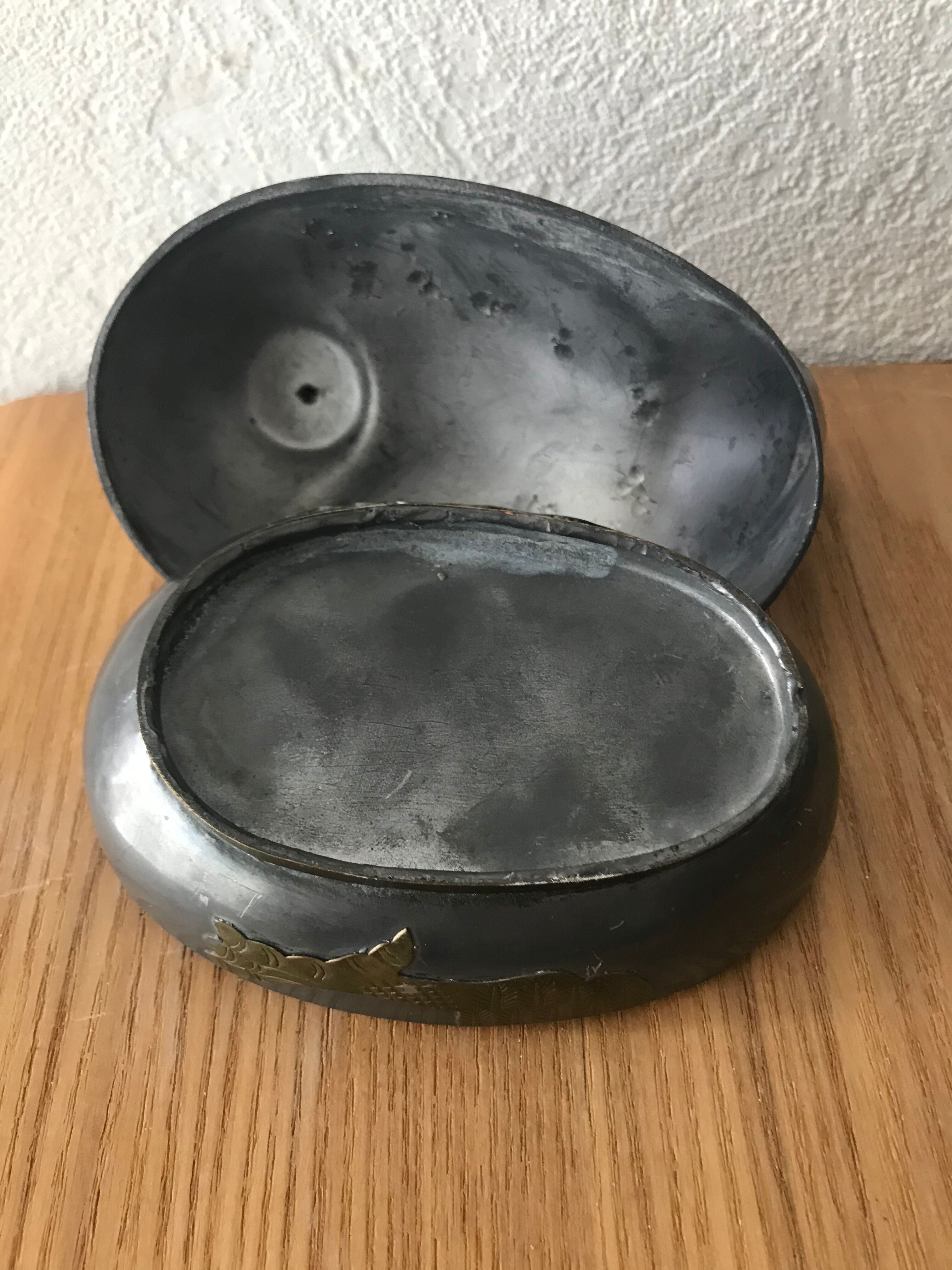 Tin duck box and brass