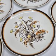 Six vintage dessert plates decorated with flowers from the Gien earthenware factory