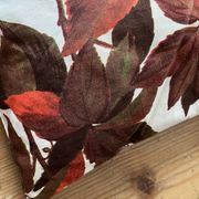 Vintage cushion with virgin vine leaf pattern.