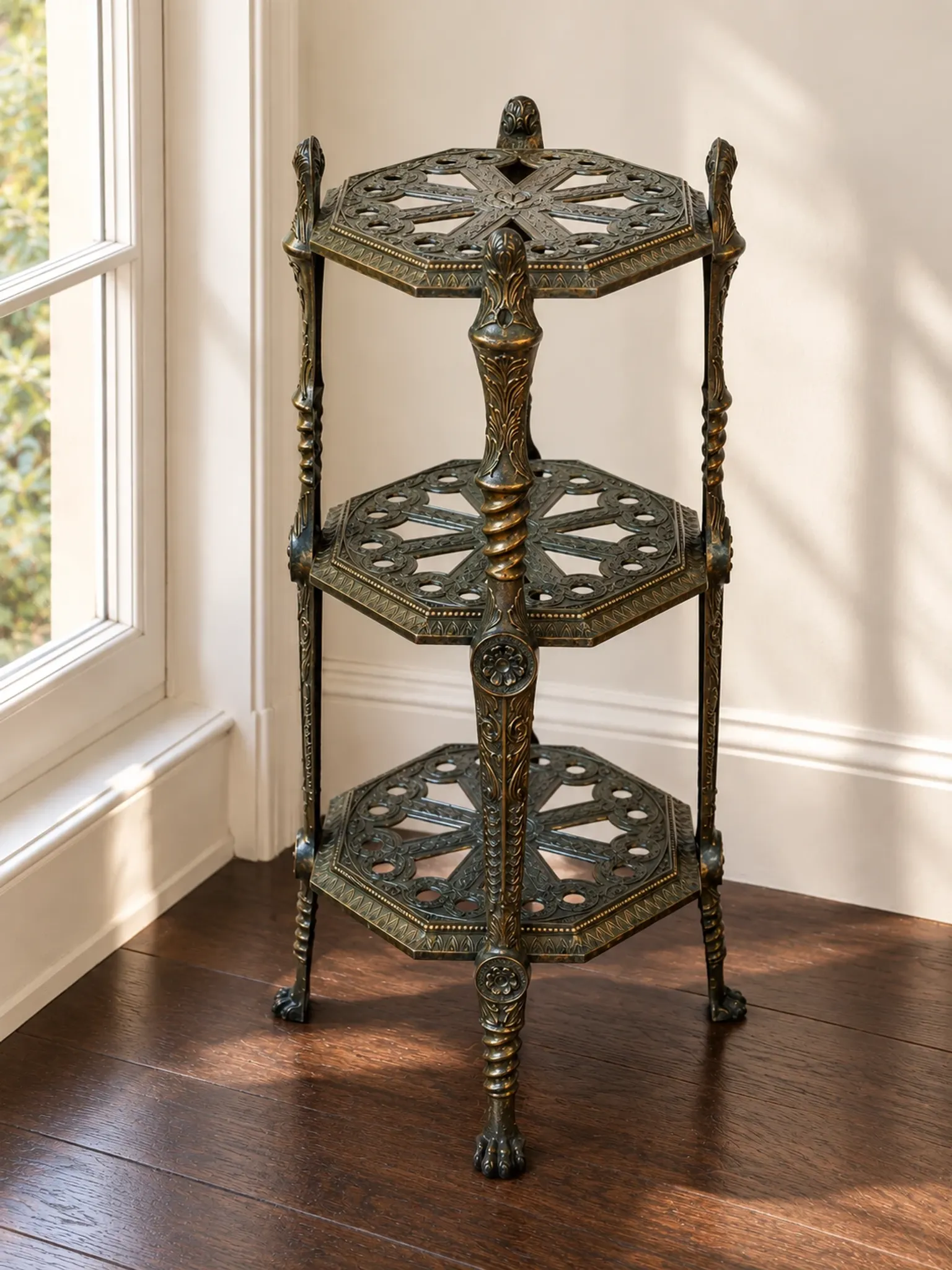 Italian side table with three openwork shelves in patinated metal.