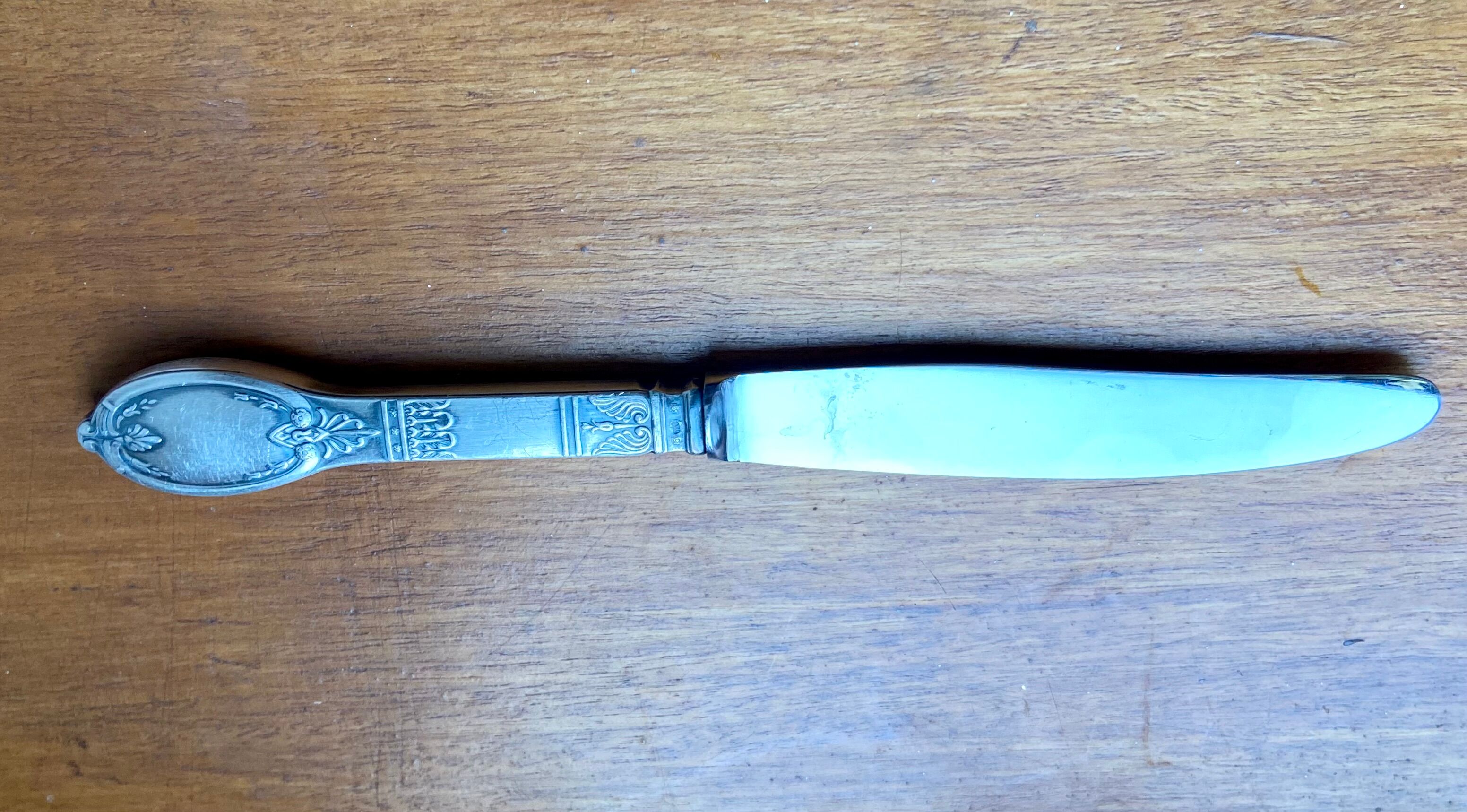 Old silver metal paper cutter