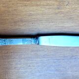 Old silver metal paper cutter