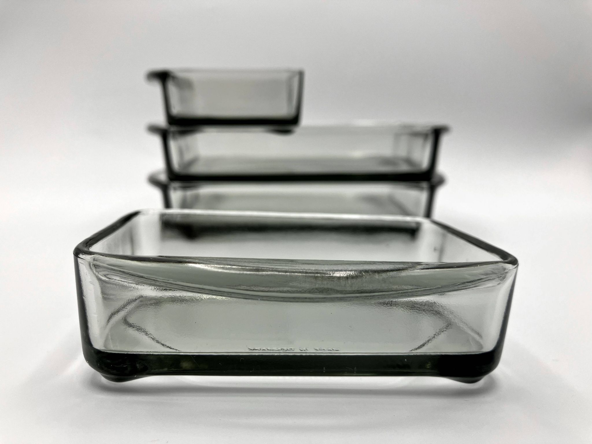 Teak tray and its 4 stackable glass dishes • Denmark • 1960