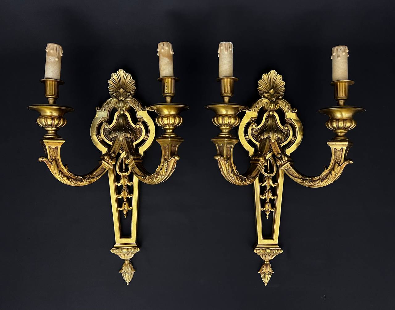 Large pair of gilt bronze wall sconces in the Louis XVI style.