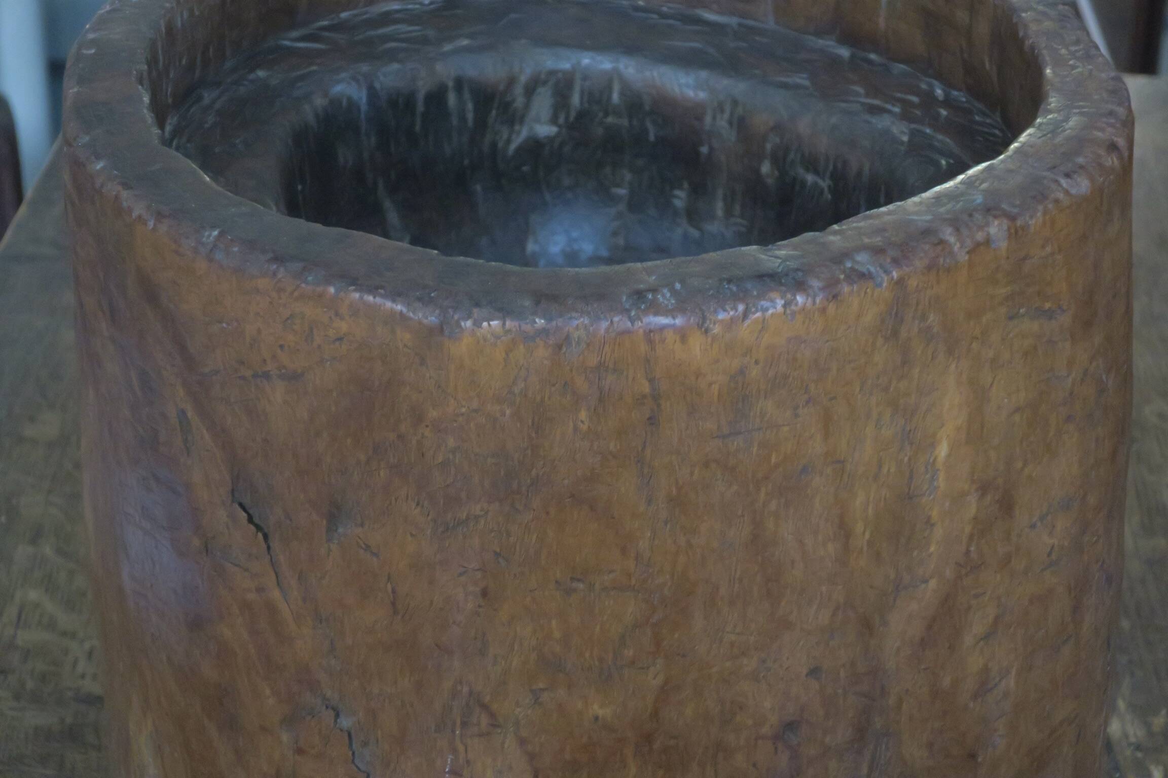 Carved antique tree stump coffee table with circular glass top