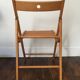 2 folding wooden chairs