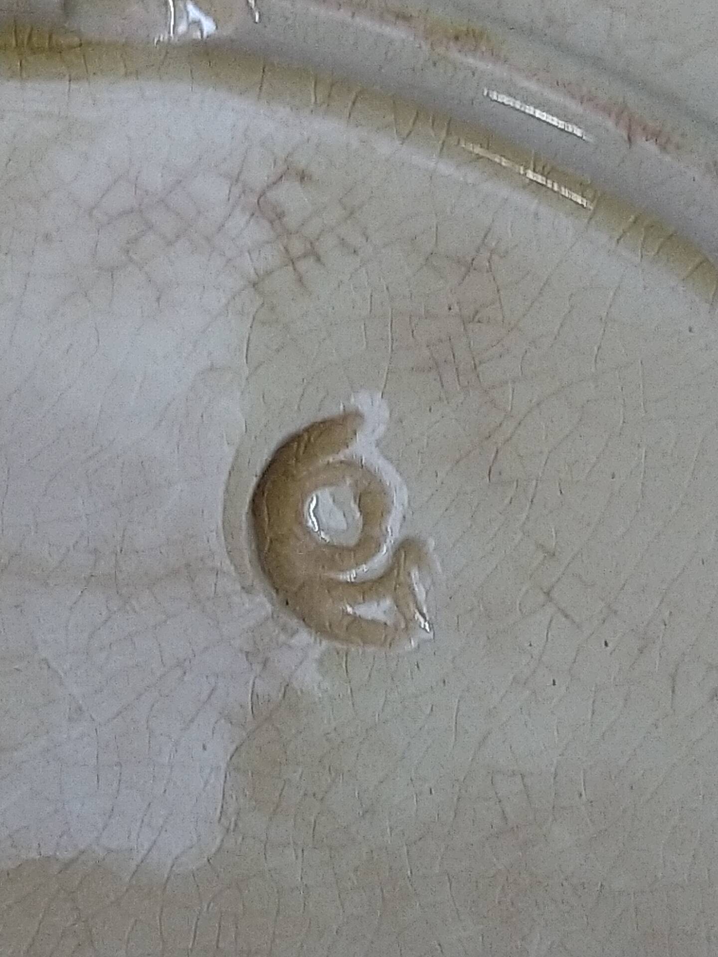 Slipware plates with vine decoration.