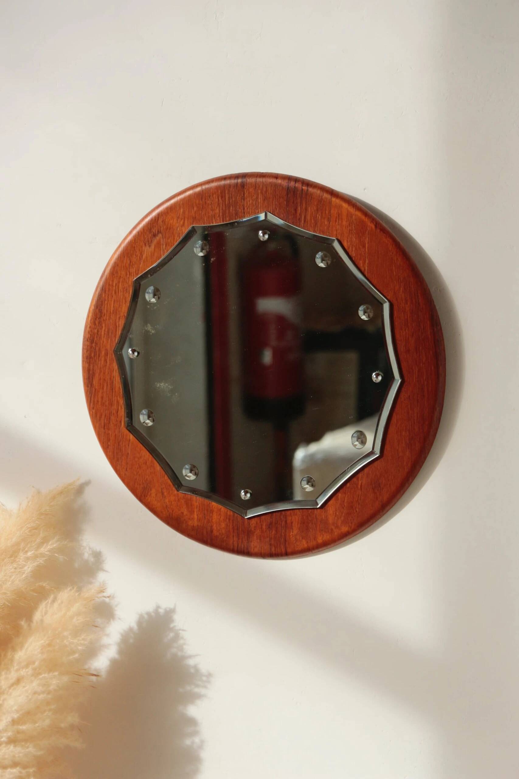 Vintage round teak mirror from the 1960s.