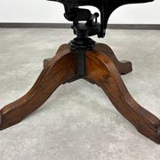 Swivel office chair in oak with a rattan seat.