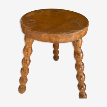 Wooden tripod farm stool