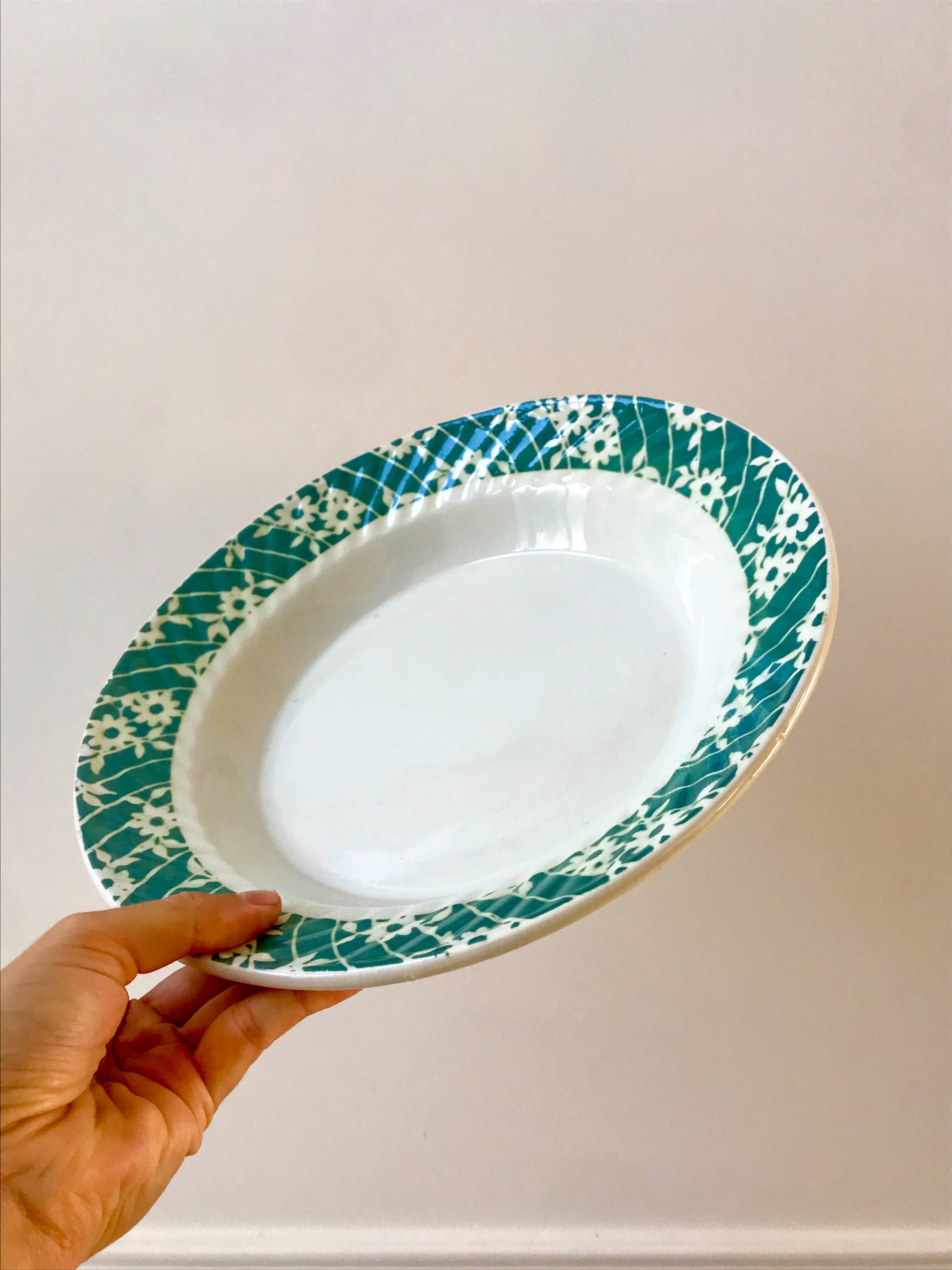 St Amand hollow dish textured white flowers on a green background, 1950s