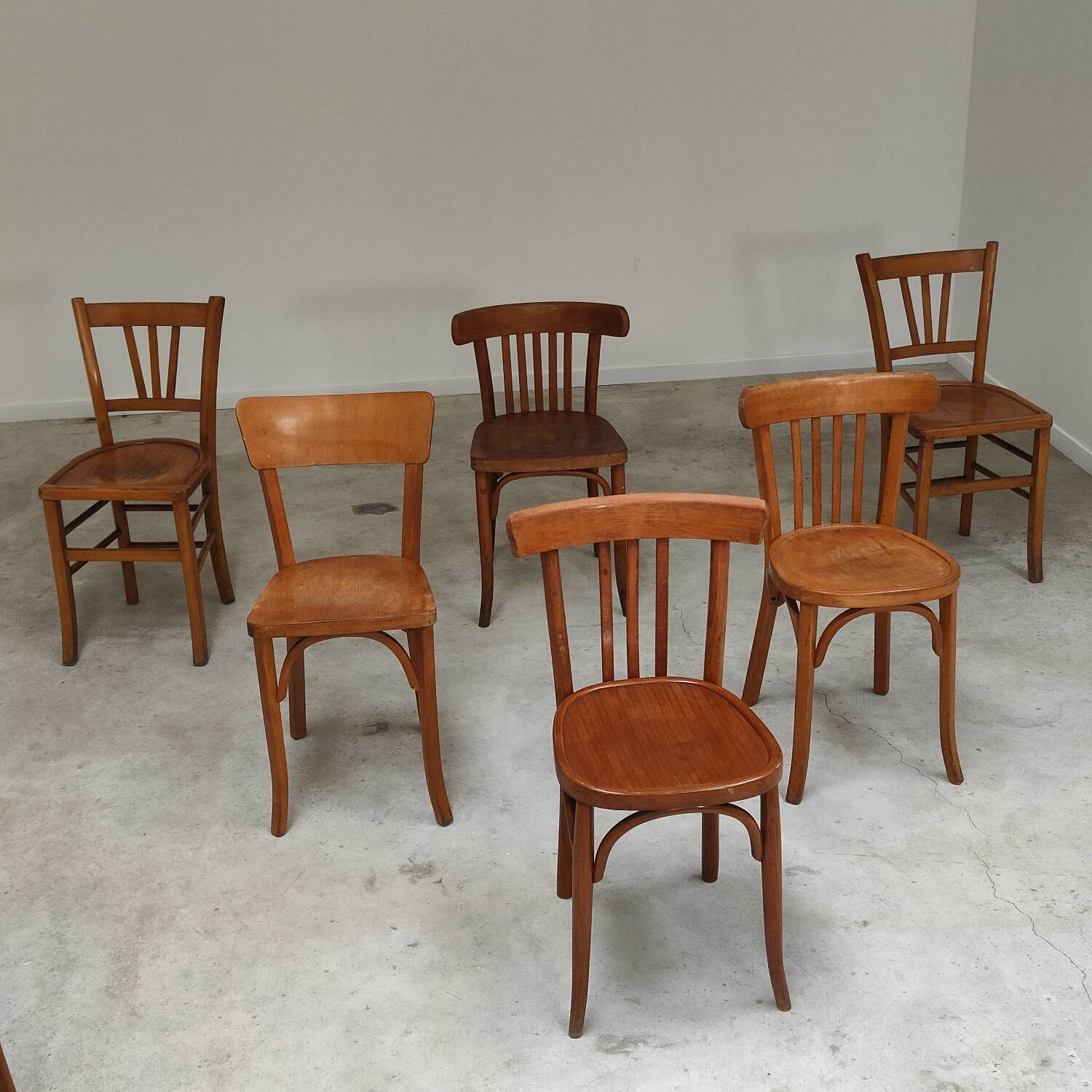 Set of 6 mismatched blond wood bistro chairs