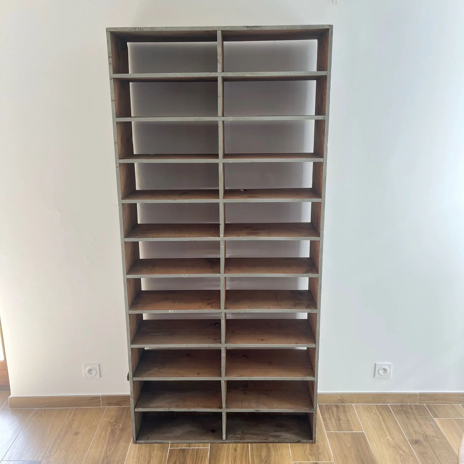 Large antique workshop cabinet with patinated wooden compartments, 20th century.