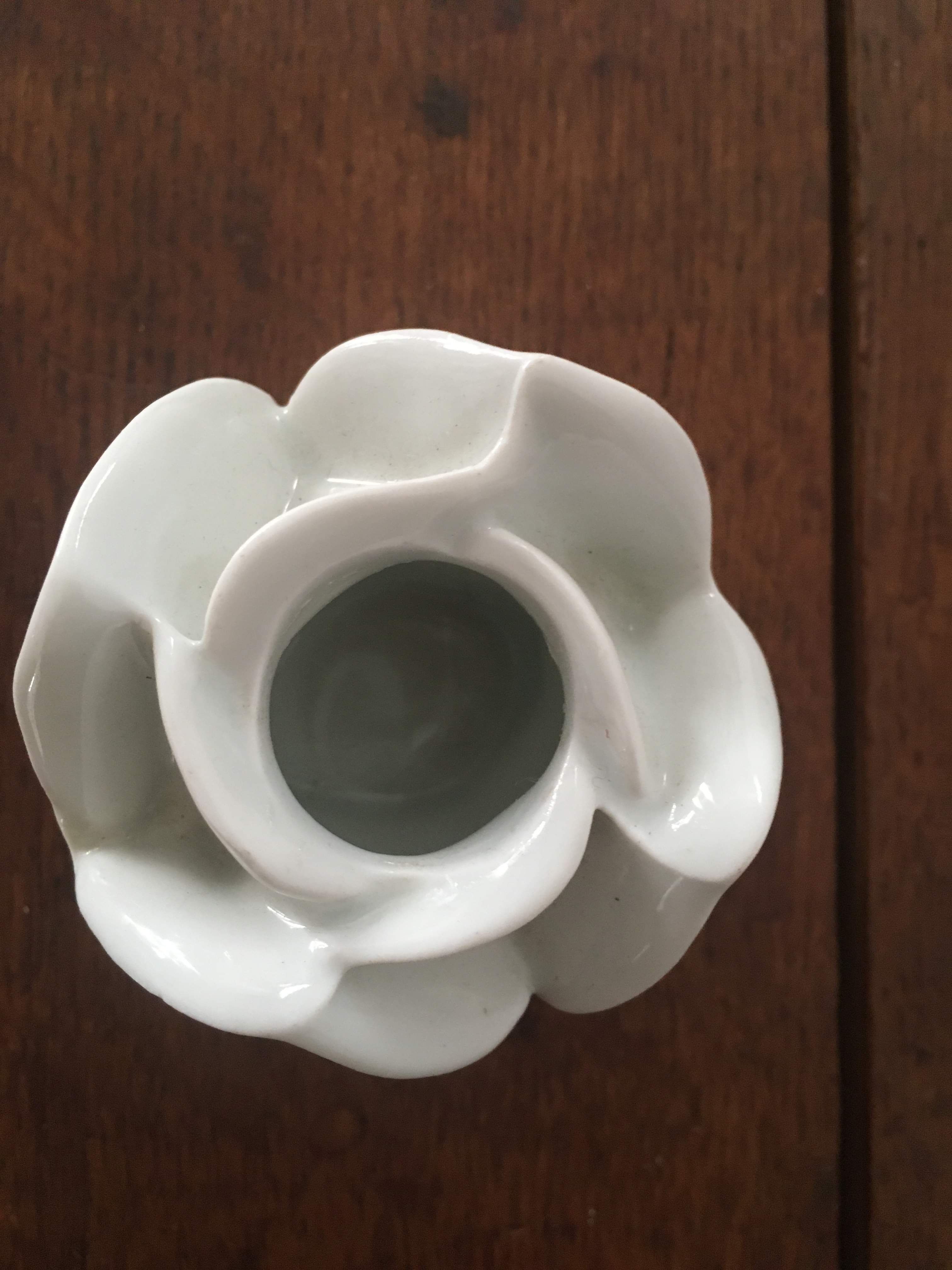 Two white porcelain flower candlesticks