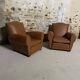 Pair of vintage club style armchairs in camel faux leather.
