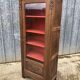 Art deco oak display cabinet with 1 glass door.