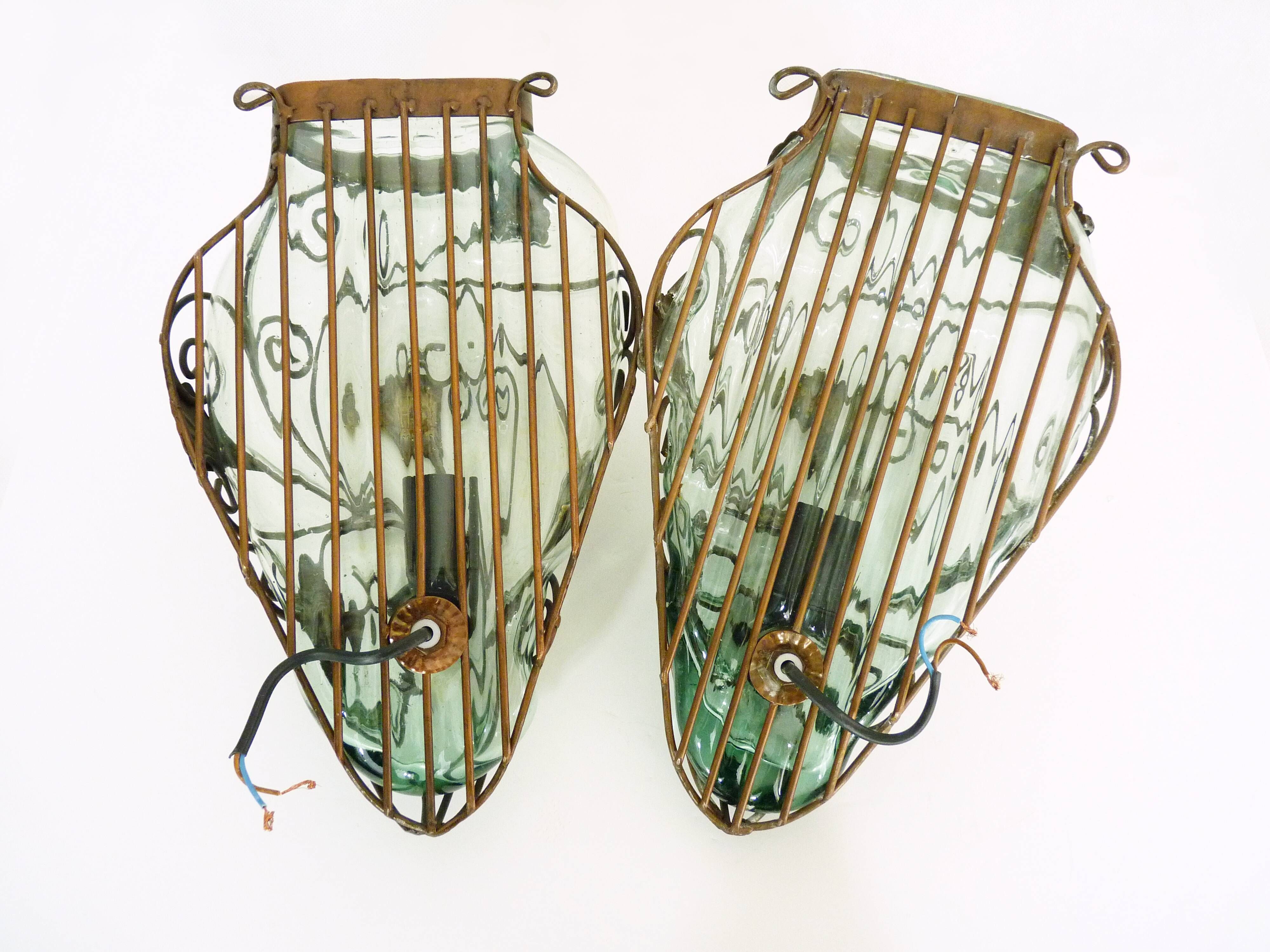 Pair of wall light cage in blown glass green color and wrought iron. Murano style. Year 80
