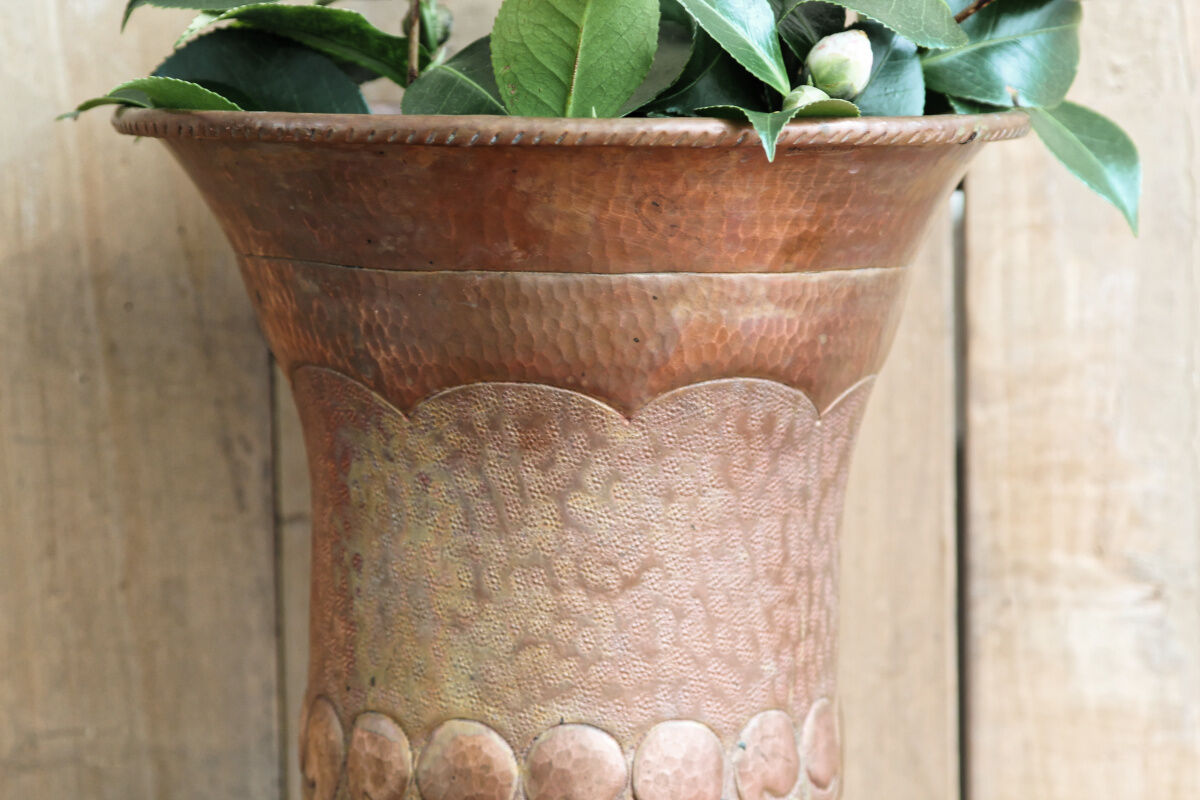 Copper vase hammered on pedestal