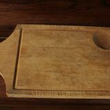 Wood cutting board with groove and handle