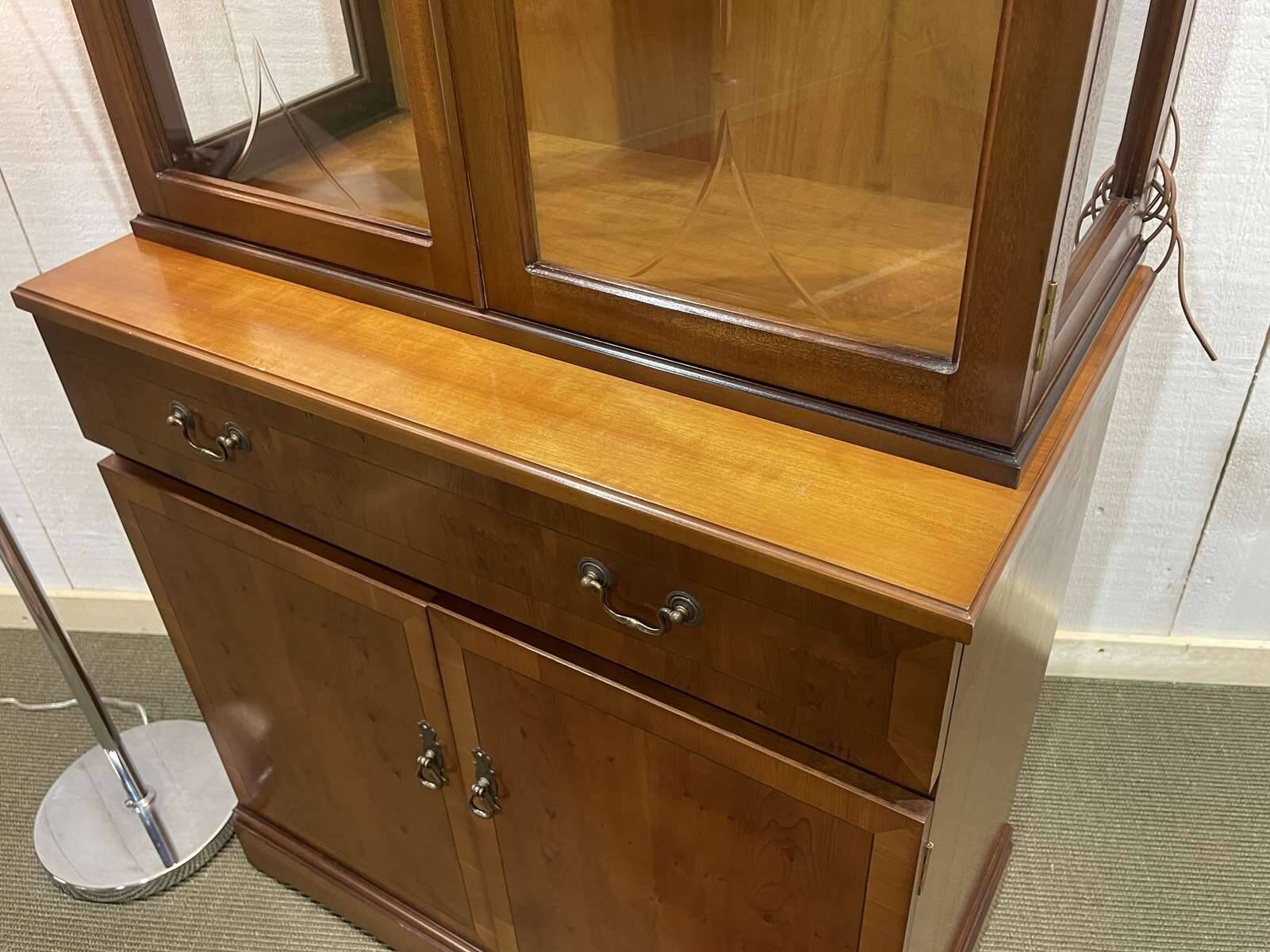 English display cabinet with two sections made of yew from the 1980s.