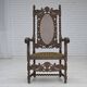 Fauteuil danois à haut dossier des années 1930, en maille, velours et bois de chêne sculpté.