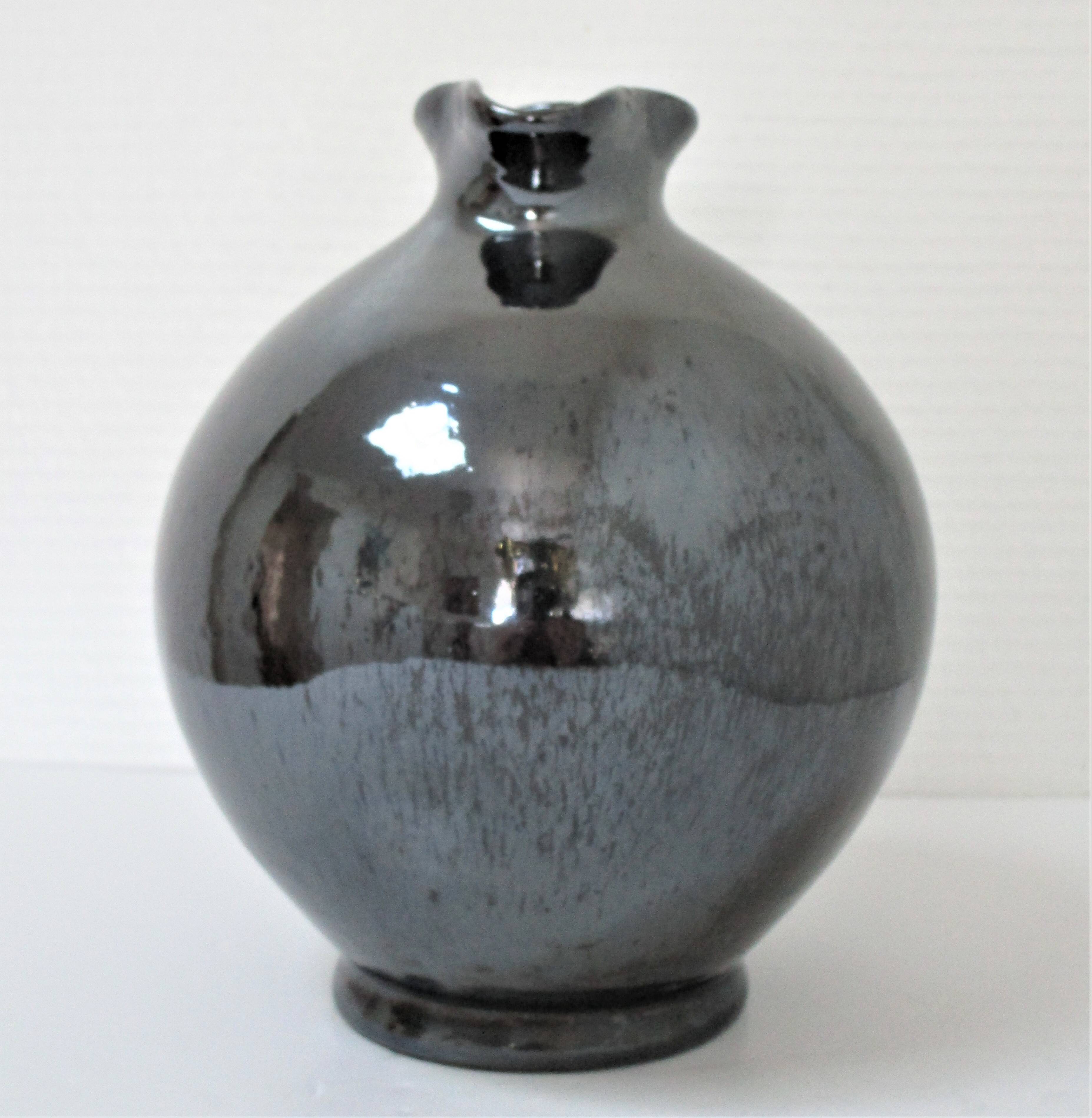 Black pearl glaze ceramic pitcher by Reinhold Rieckmann signed