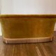 Old gold toad bench