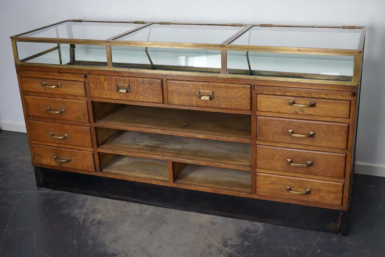 Counter or shop window in oak glass and brass France around 1920