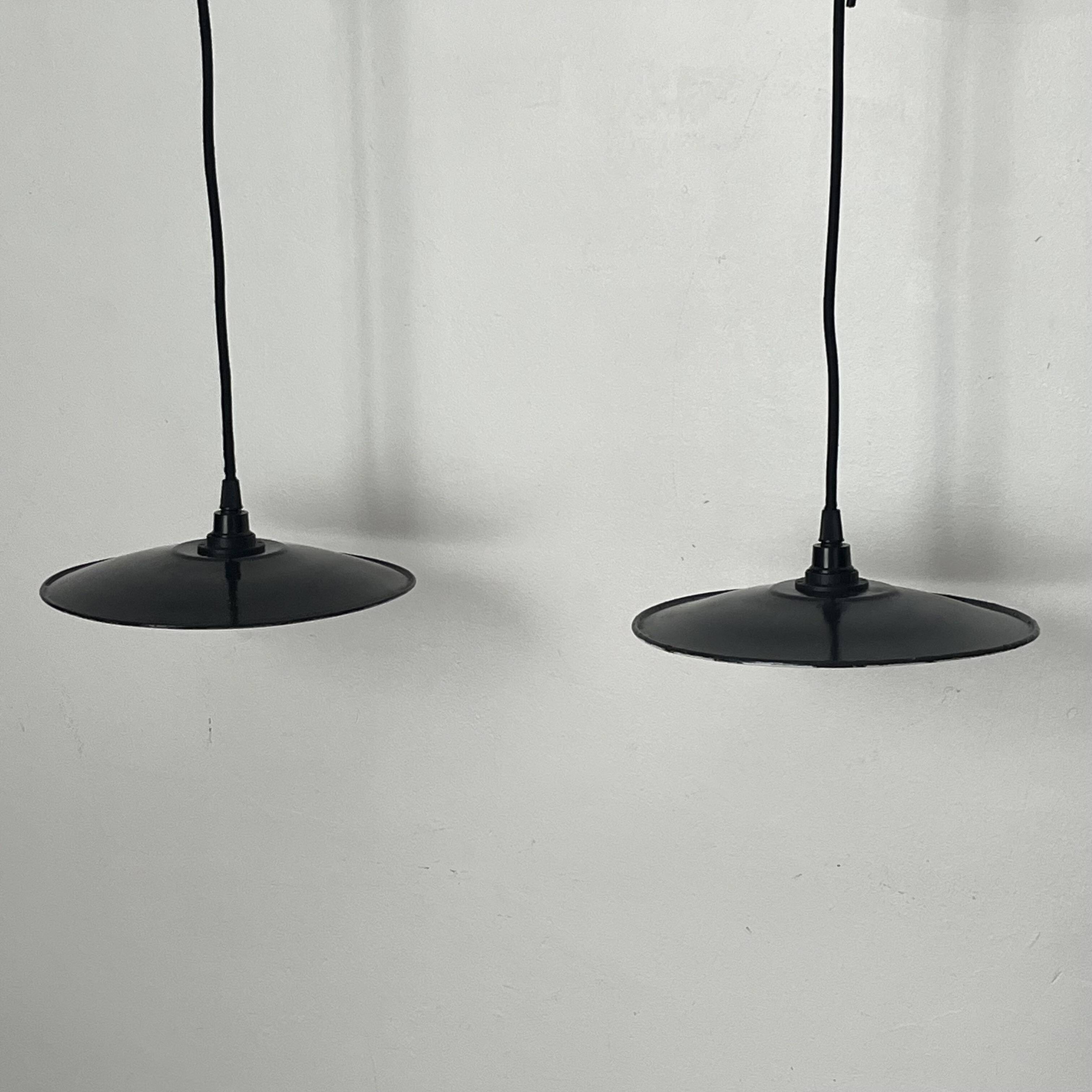 Pair of black enamelled metal bowls