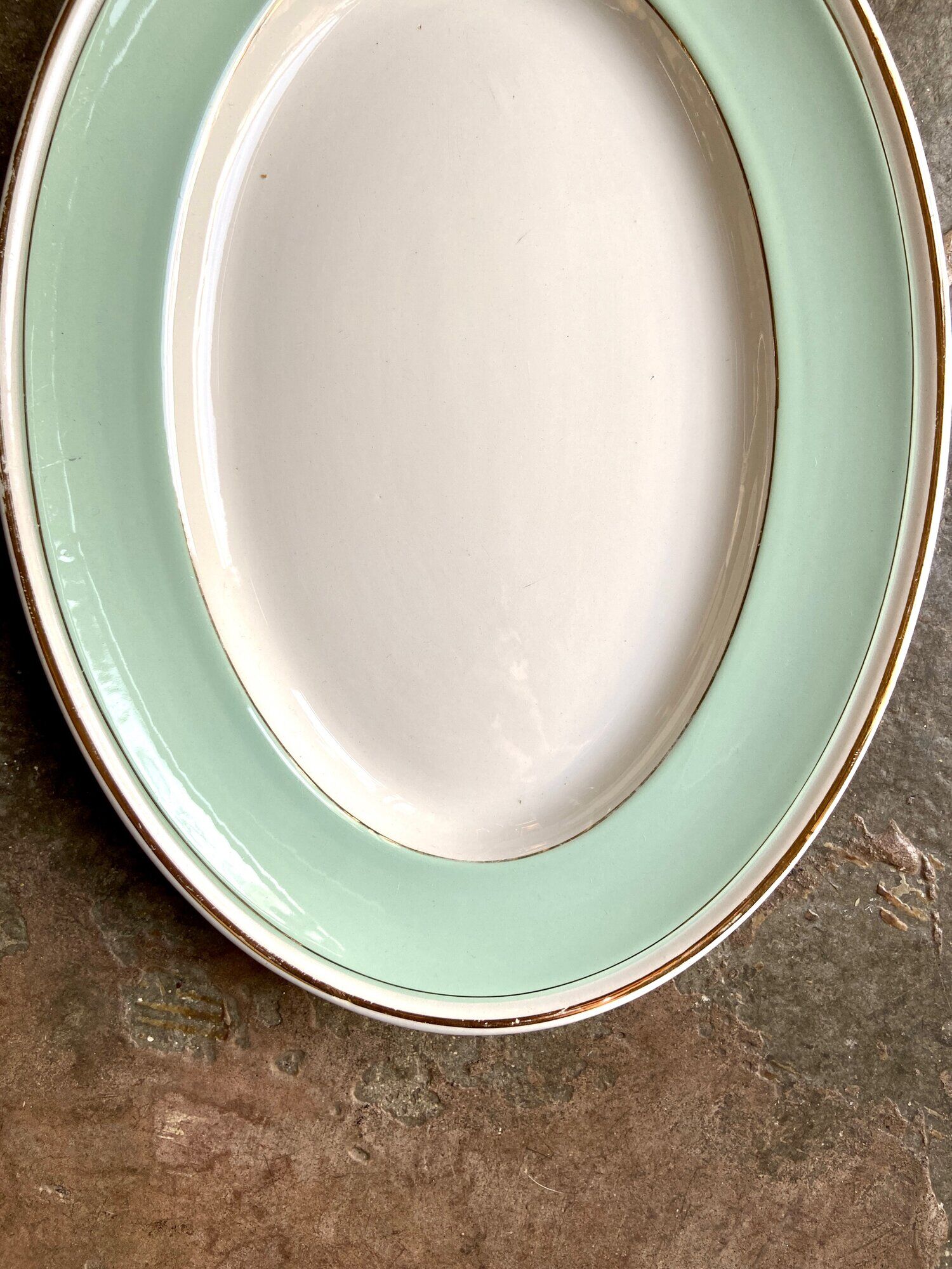 Luneville oval dish in water-green and golden opaque porcelain