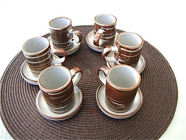 6 coffee cups and sandstone subcups