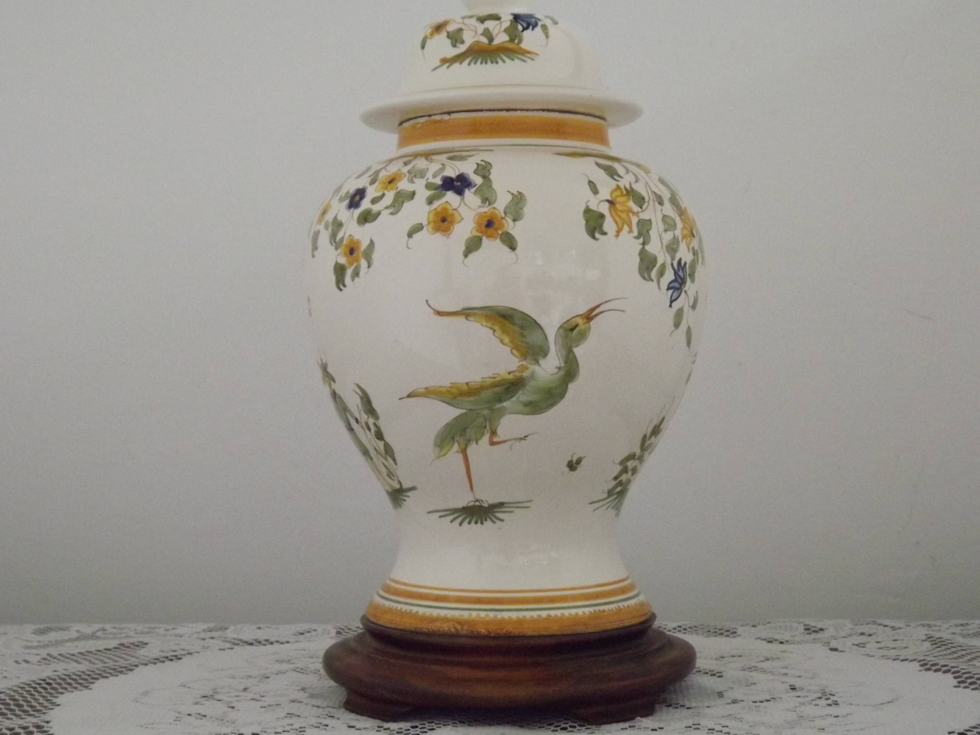 Table lamp with wooden base and fringed shade