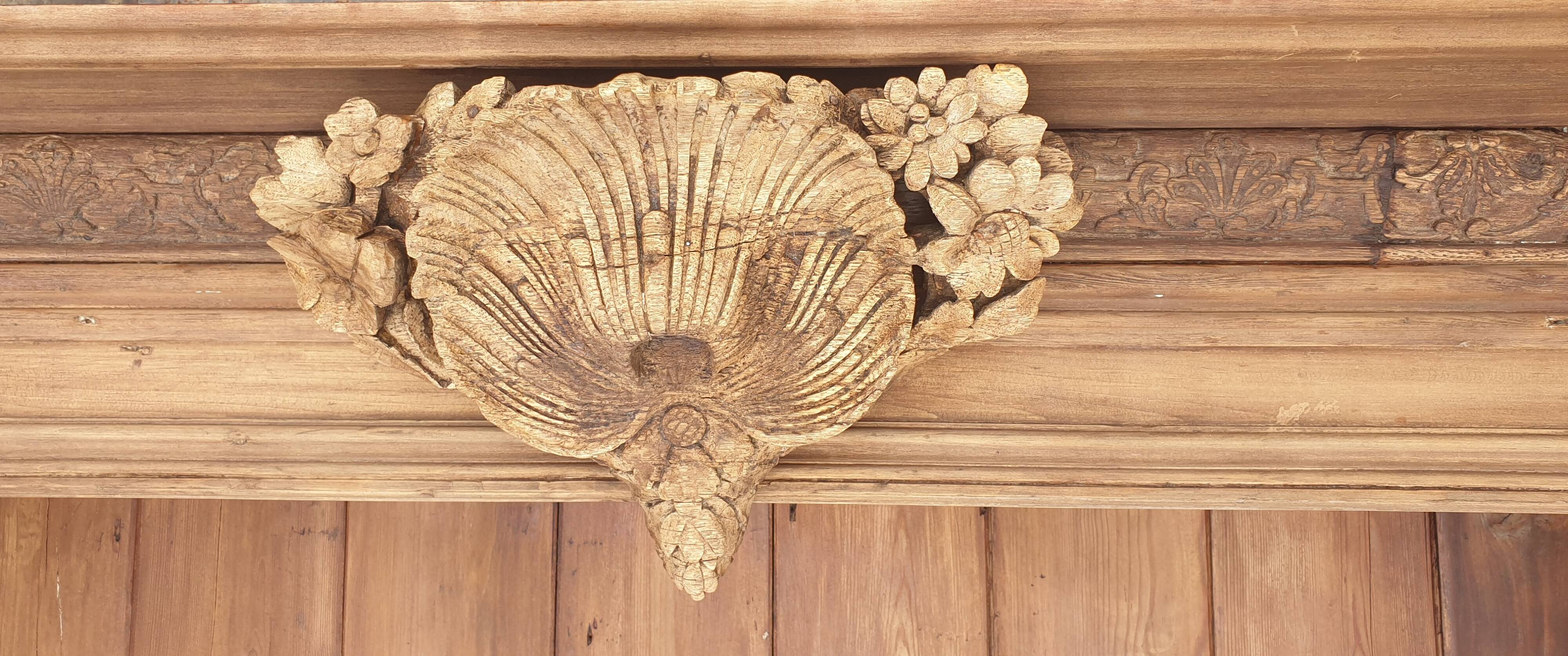 Natural wood bookcase with 3 doors and shelves