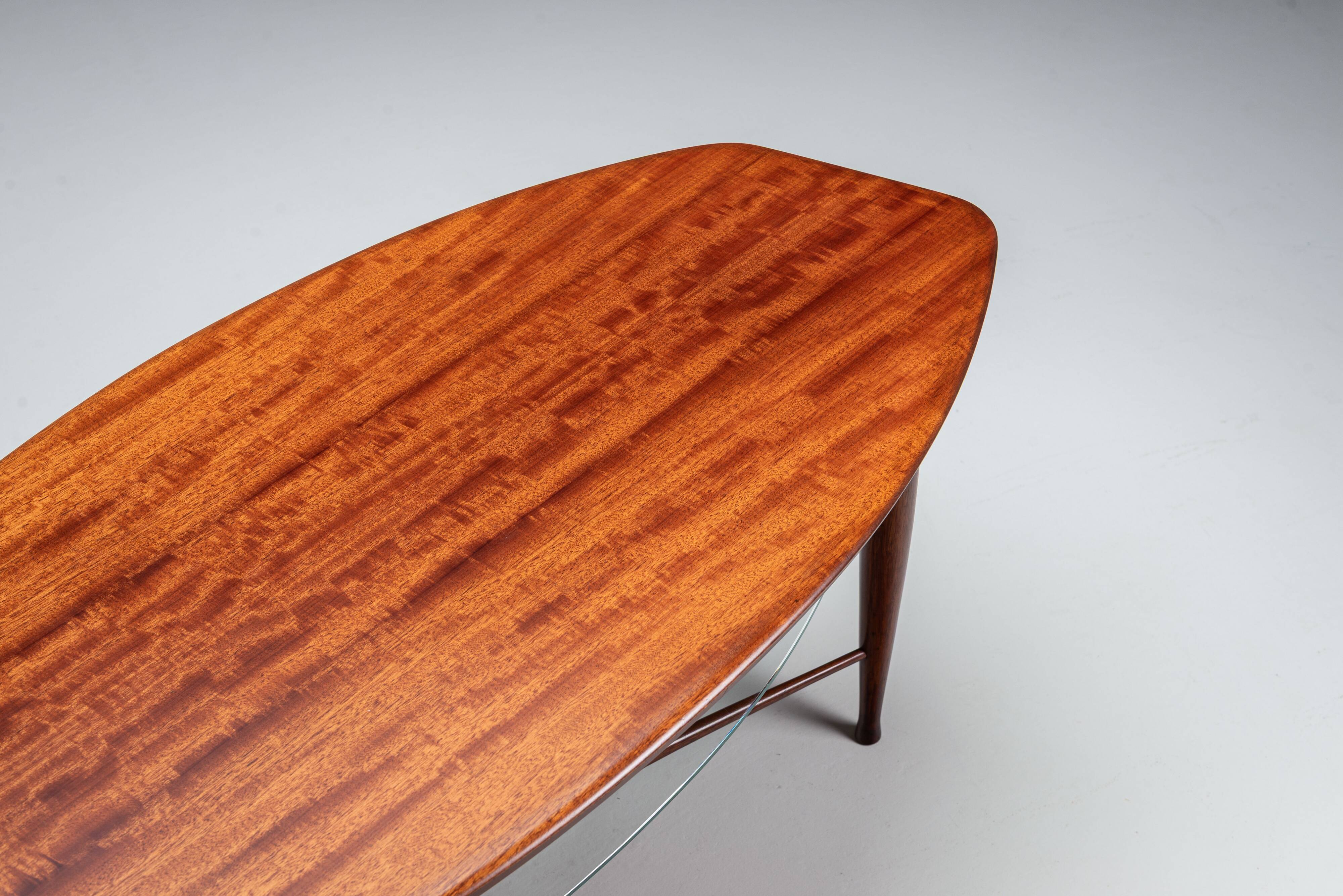 Assymetrical coffeetable with glass storage and cross leg details