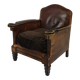 Antique leather club chair with stud detailing