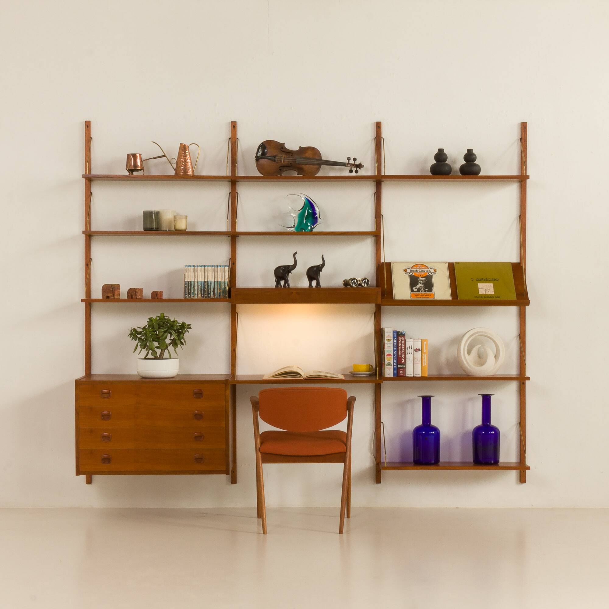 Danish teak wall unit in the style of Cadovius, Sorensen with a lamp, 1970s