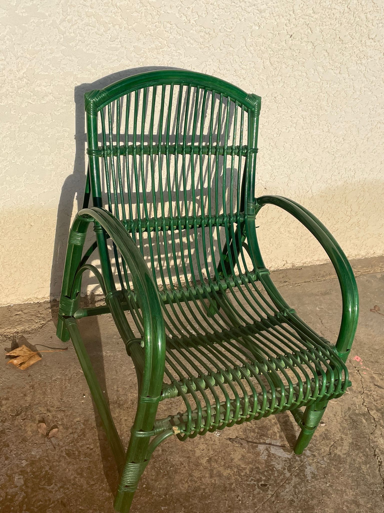 Green rattan armchair