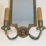 Pair of mirror and bronze wall lamps with lions' heads, french work. around 1940