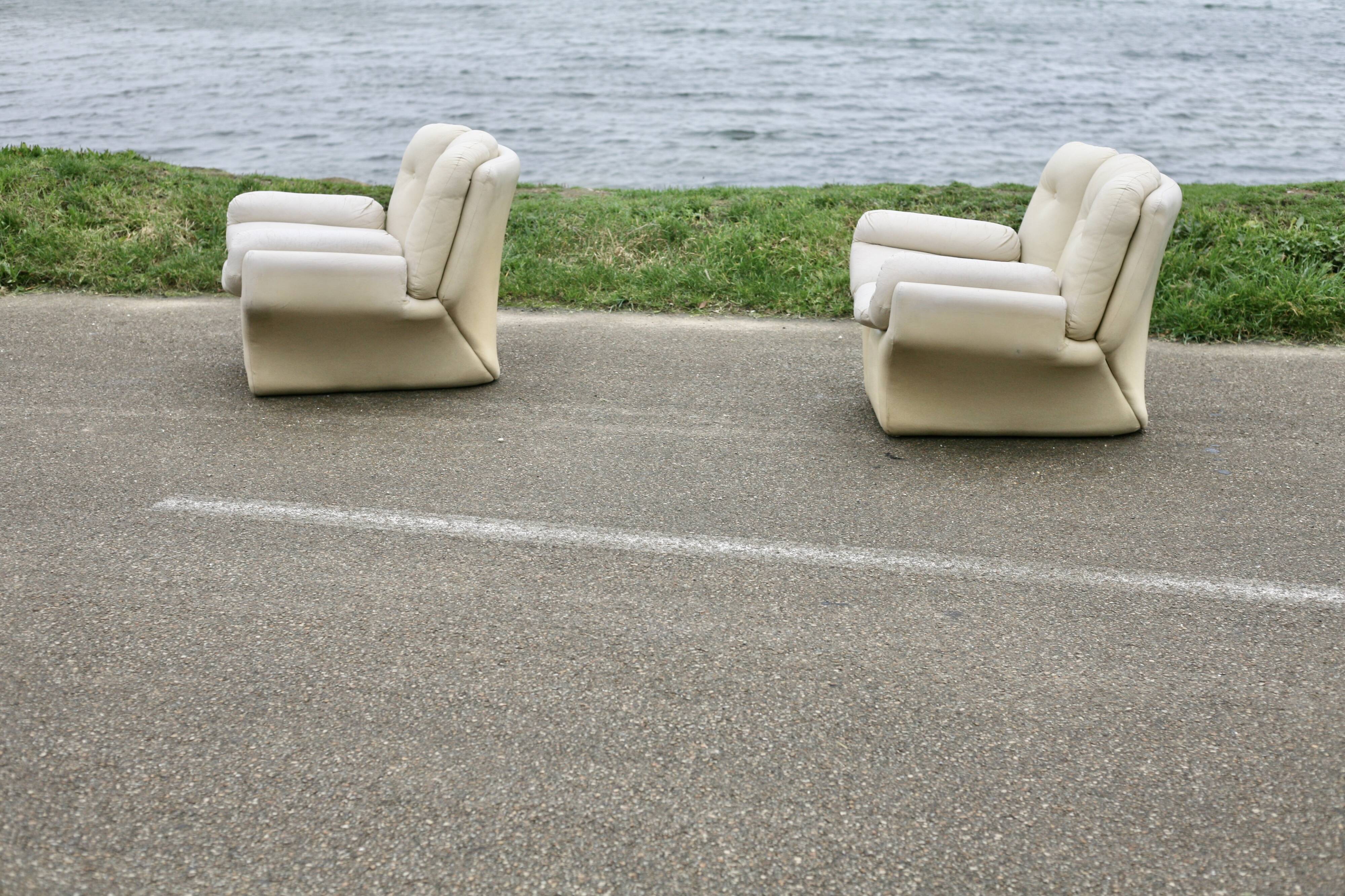 Pair of leather “space age” armchairs. Cream colour". Circa 1970.