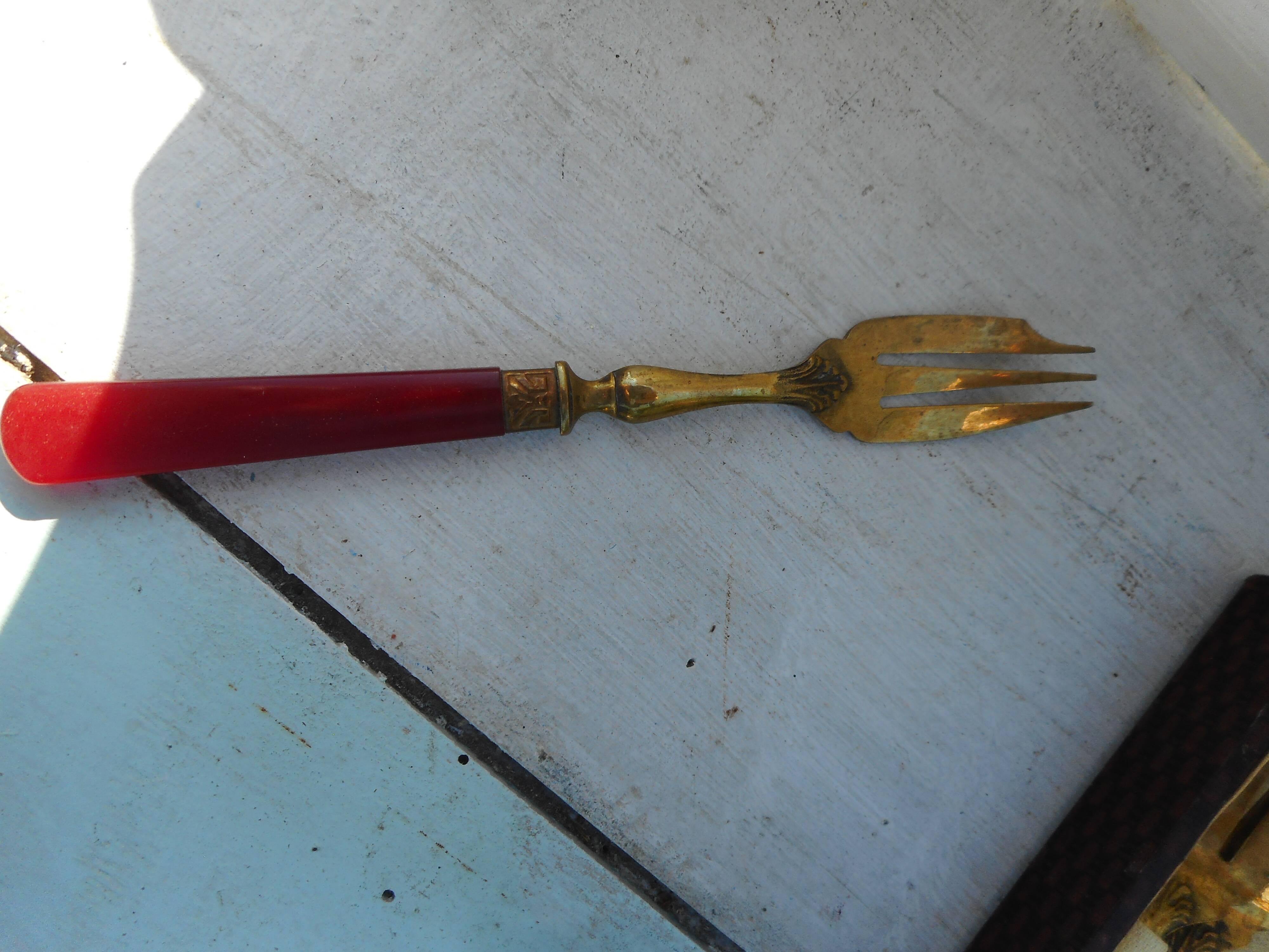 Twelve bakelite handle cake forks