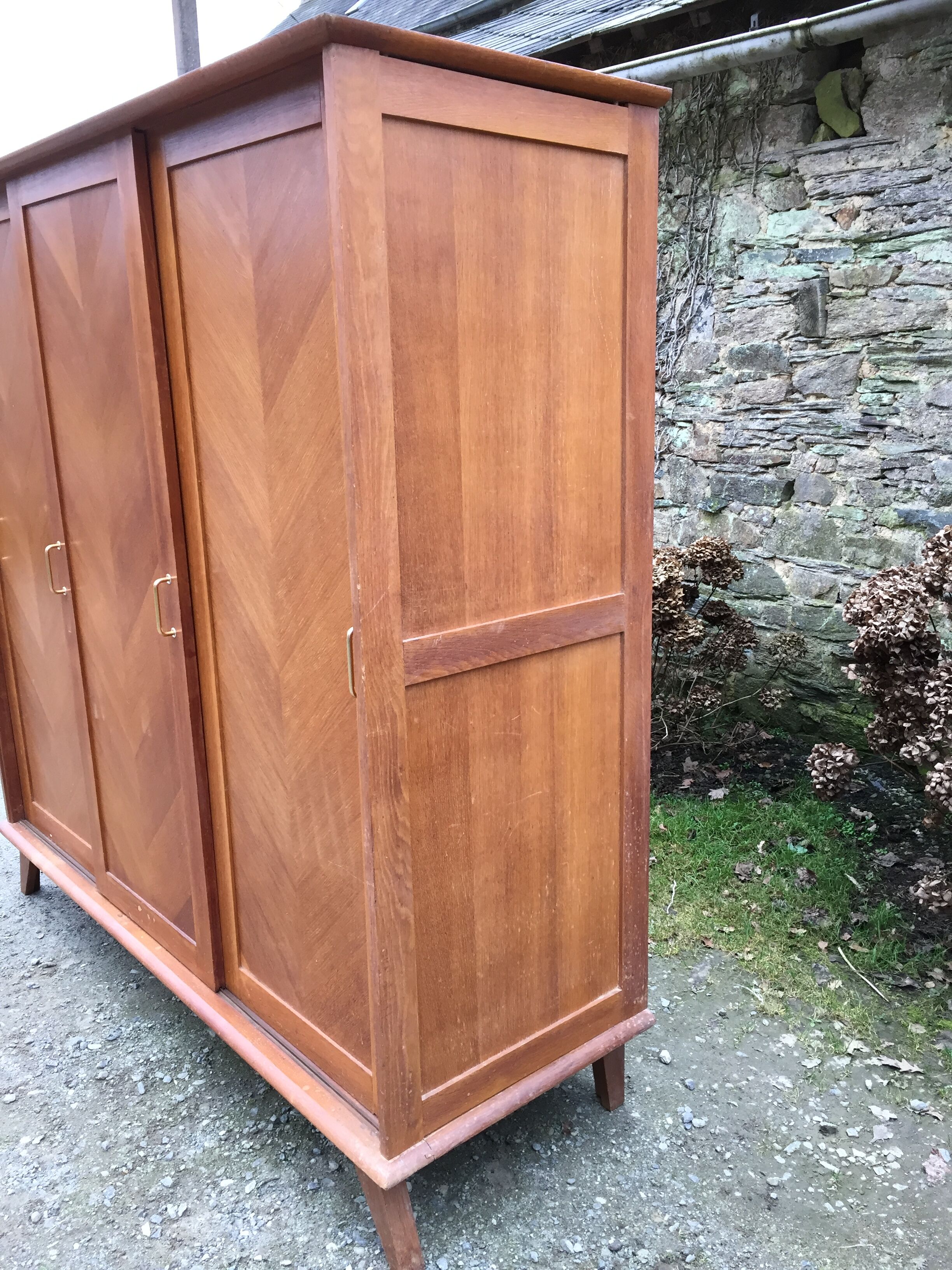 Vintage wardrobe compass feet with 3 sliding oak doors.