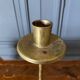 Pair of brass candlesticks decorated with 20th century stars